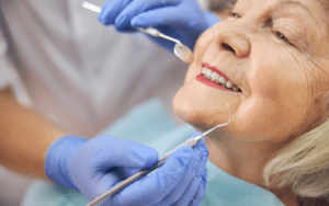 Elderly woman receiving dental care