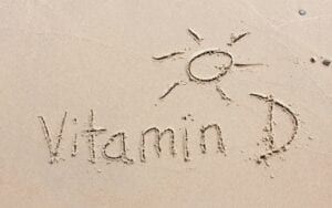 Vitamin D written in the beach